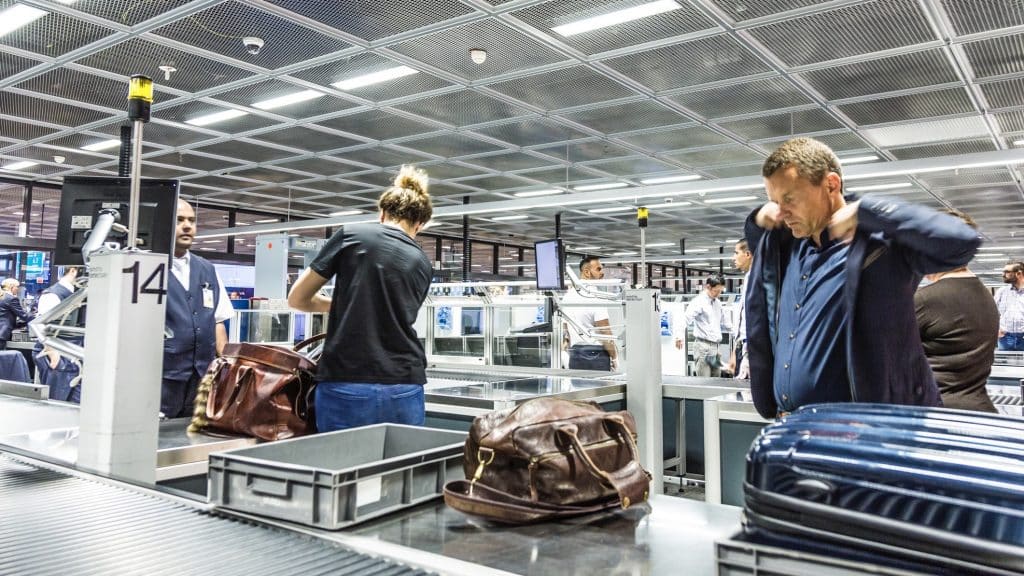 People At Security Check At Frankfurt International Airport