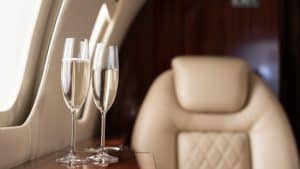 Selective Focus Of Interior Of Plane With Champagne Glasses For Trip