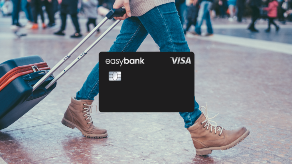 Easybank Visa im Vordergrund, im Hintergrund Beine einer Frau und ein Koffer