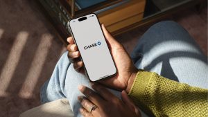 Chase DE Press Image 02 Woman Holding Smartphone With Chase App Landscape